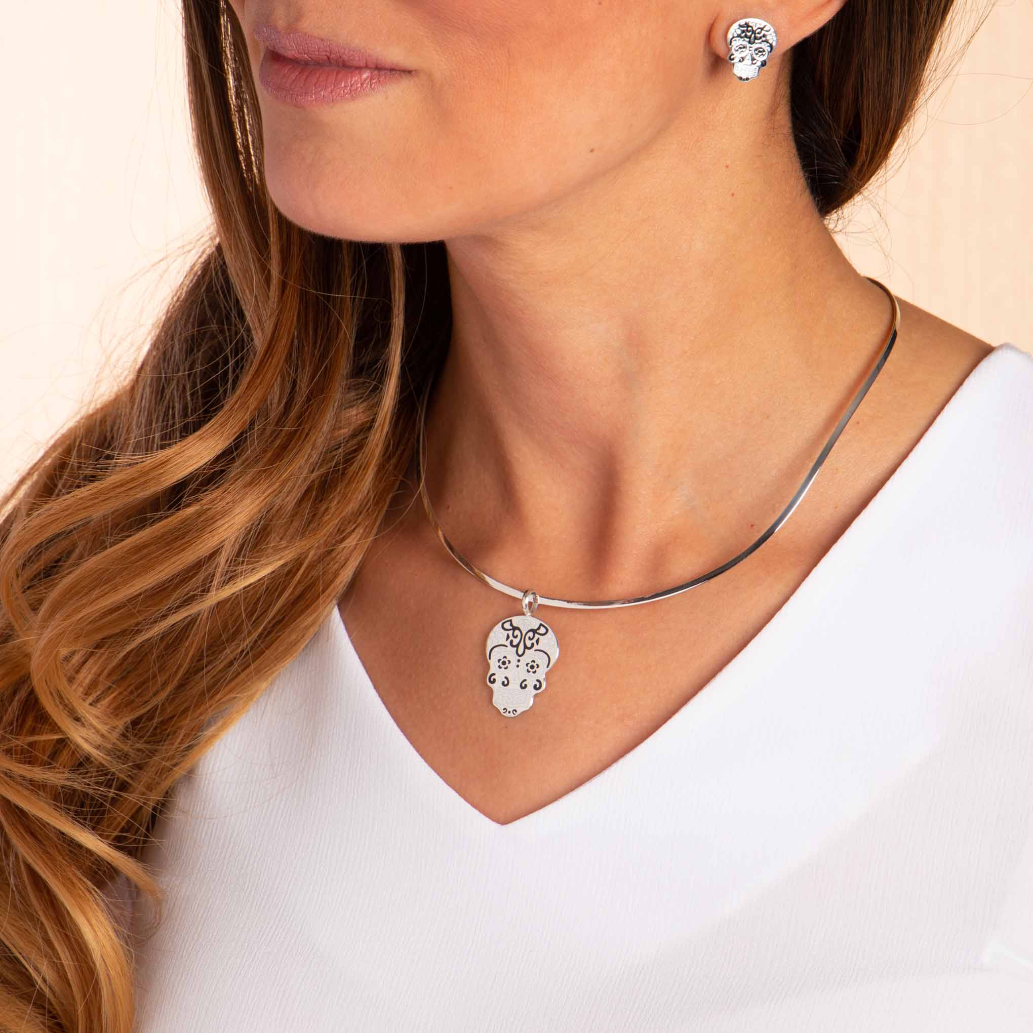 Dije y aretes Calaveras de Plata